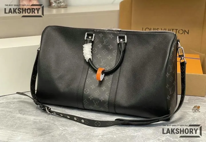 Louis Vuitton 1:1 Mirror Replica Taiga Eclipse Keepall Bandouliere 50 Black 50CM/19.7IN Louis Vuitton Replica Keepall Louis Vuitton 1:1 Mirror Replica Taiga Eclipse Keepall Bandouliere 50 Black 50CM/19.7IN Louis Vuitton Replica Keepall