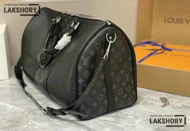 Louis Vuitton 1:1 Mirror Replica Taiga Eclipse Keepall Bandouliere 50 Black 50CM/19.7IN Louis Vuitton Replica Keepall Louis Vuitton 1:1 Mirror Replica Taiga Eclipse Keepall Bandouliere 50 Black 50CM/19.7IN Louis Vuitton Replica Keepall